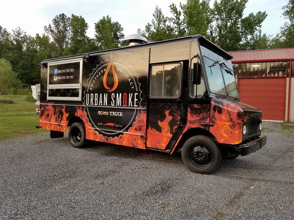 orange flames on black wrapped food truck