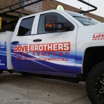 blue and white parked pickup truck for dove brothers