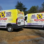 parked Bestway vans with graphics and logos on the side