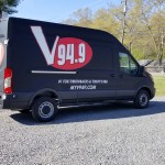 black van with 94.9 graphic from radio station