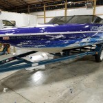 side of blue and white boat wrap