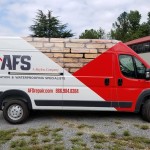 red and white wrapped afs van