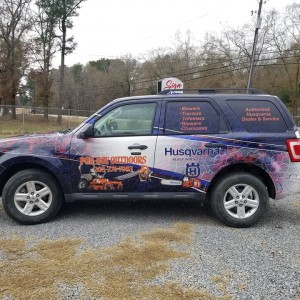 side of Wrapped suv with lightning pattern blue and red