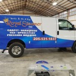 blue and white royal steamer advertisment on van wrap