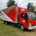 wrapped box truck with red and white pattern